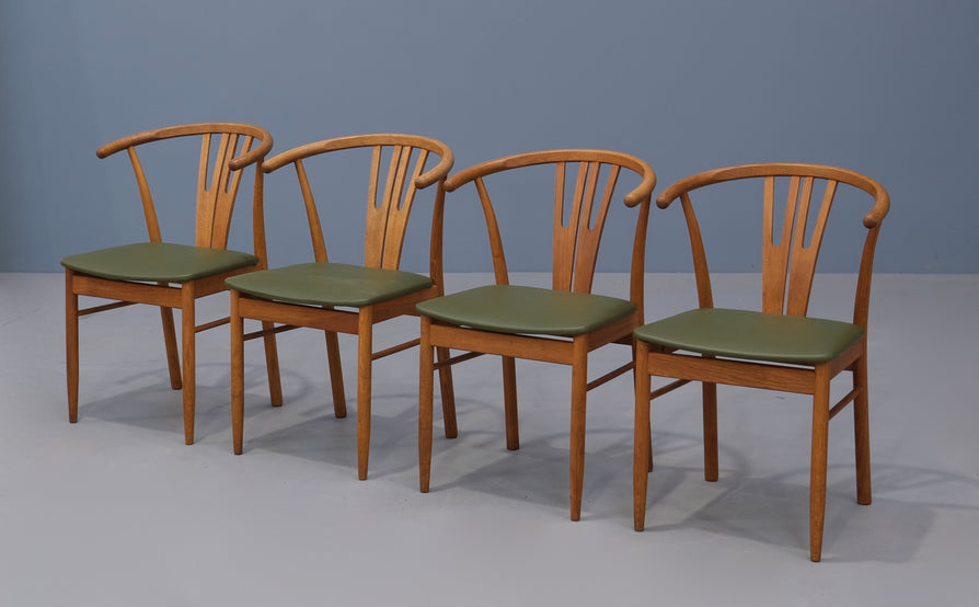 Four Danish Wishbone Dining Chairs in Oak