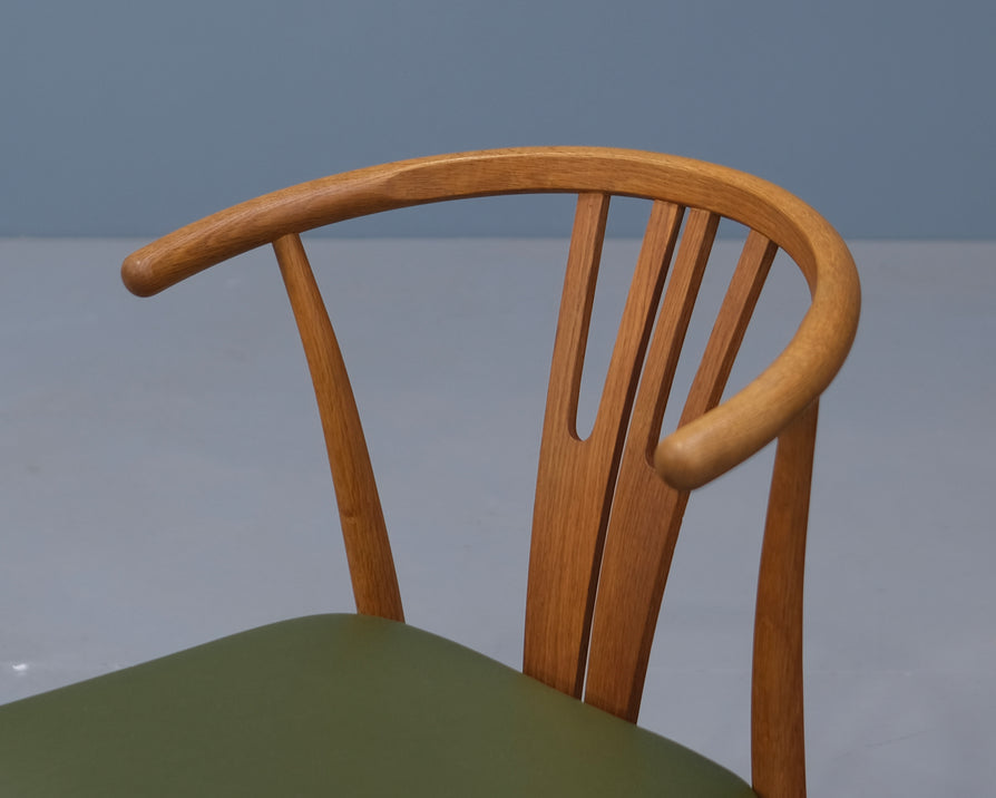 Four Danish Wishbone Dining Chairs in Oak